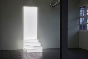 Cockatoo Island, Ryan Gander, 'Forces outside of you (Because you cede your life decisions and consequences to forces outside of you)' (2017). Three winding steps leading to a shape resembling a door set against the gallery wall, emitting a glow that is the colour of daylight. 8.5 x 25.5 x 11.9 cm. Installation view: 21st Biennale of Sydney, Cockatoo Island, Sydney (16 March–11 June 2018). Courtesy the artist; TARO NASU Gallery, Tokyo and Lisson Gallery, London and New York. Photo: silversalt photography.